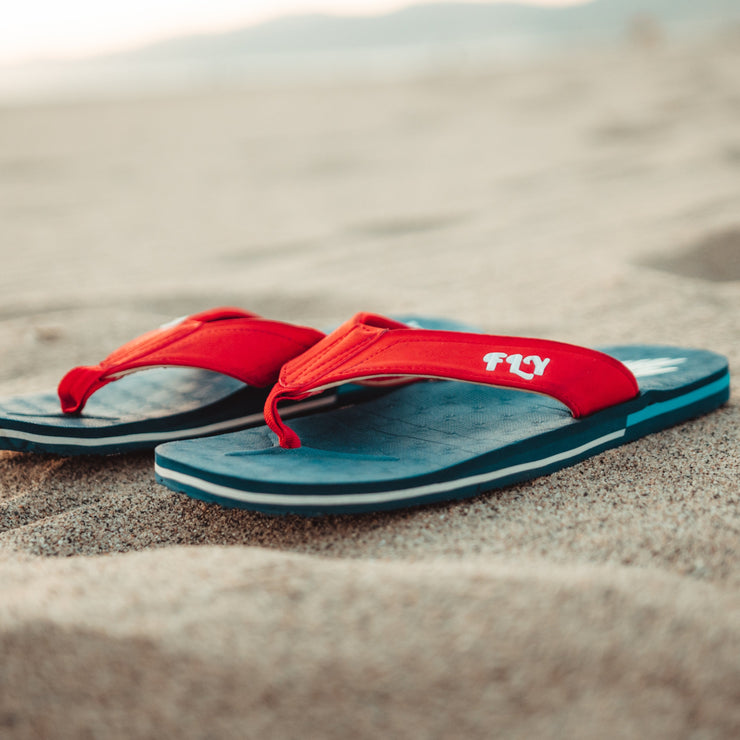Stylish and patriotic The Gringos flip flops in Red, White, and Blue, perfect for showcasing your FLY spirit